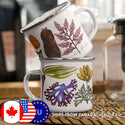 Metal enamel camping mug with silver rim and white background covered in seaweed illustrations.
